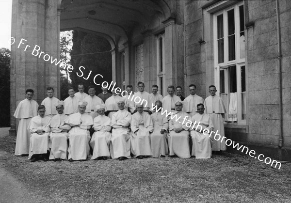 GROUP OF CLERICS AT HOUSE